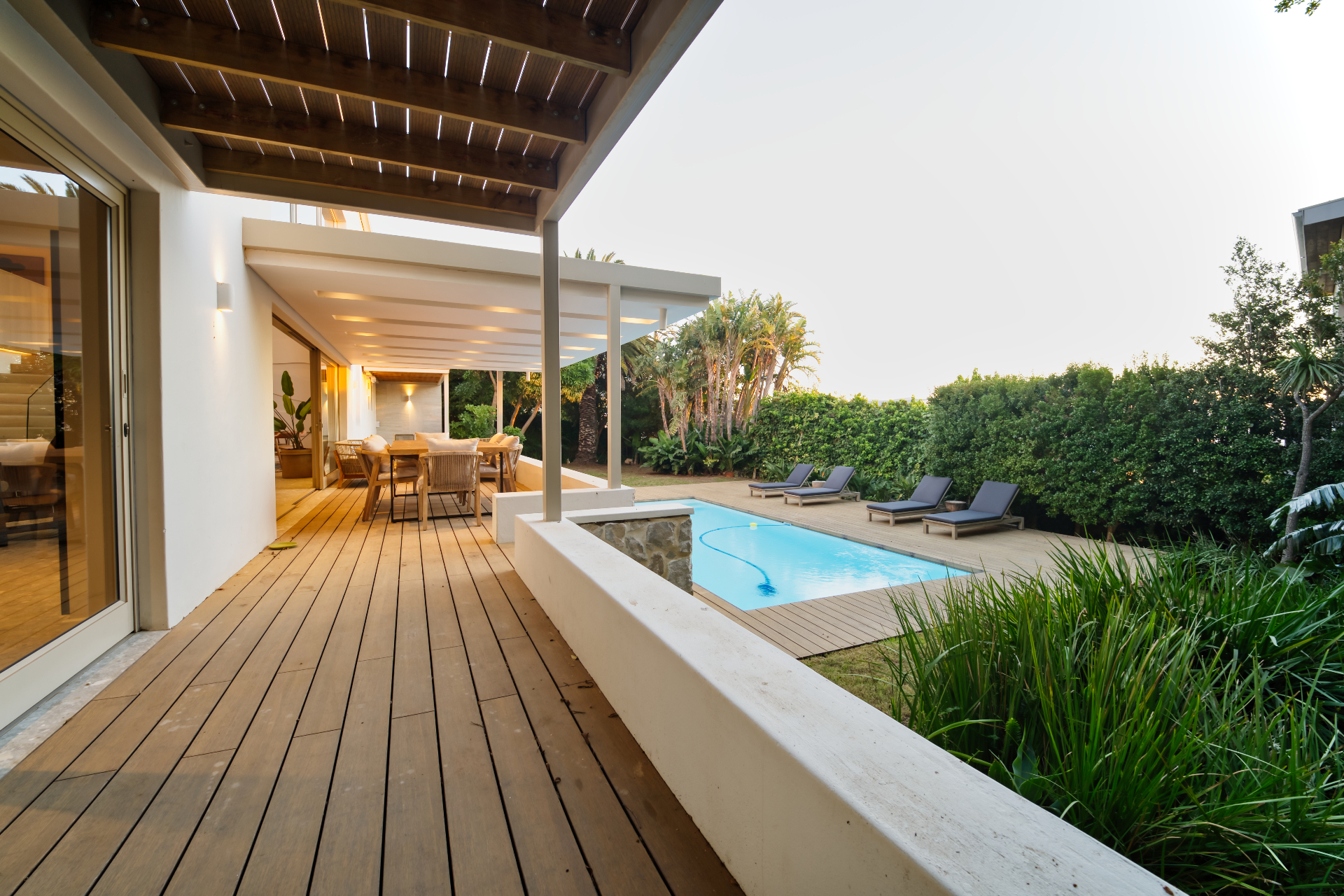 Contemporary Cape Town residence at dusk — pool and rear elevation